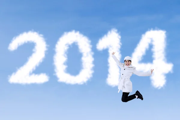 Winter woman jumps with new year 2014 — Stock Photo, Image