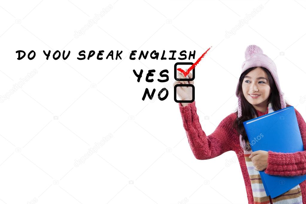 Schoolgirl in winter wear studying English