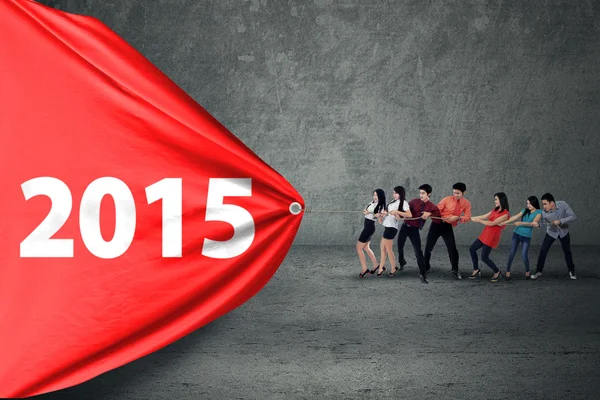 Equipe de negócios hispânica arrastar número 2015 — Fotografia de Stock