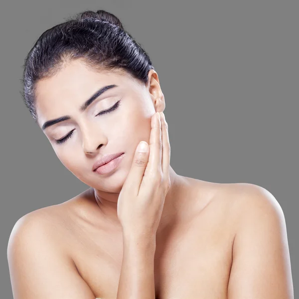 Beautiful woman touching her skin face — Stock Photo, Image