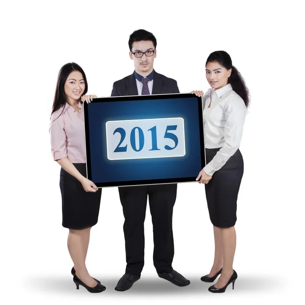 Businessteam segurando número 2015 — Fotografia de Stock