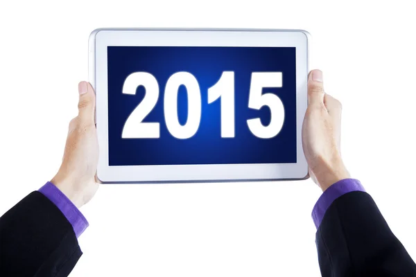 Hands with digital tablet and number 2015 — Stock Photo, Image