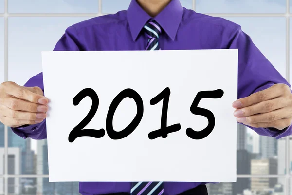 Uomo di successo mostrando il numero 2015 — Foto Stock