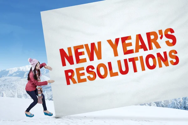 Student with a resolutions banner — Stock Photo, Image