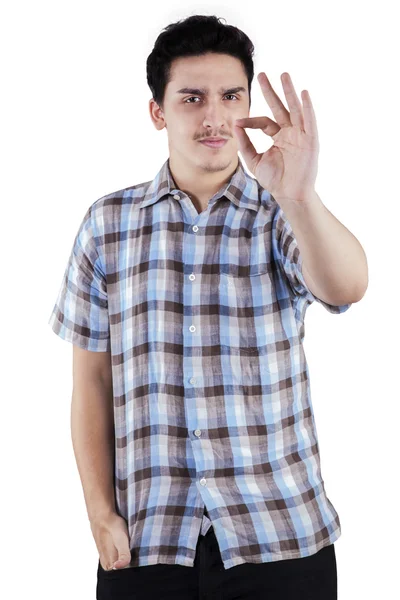 Caucasian man gesturing OK sign — Stock Photo, Image