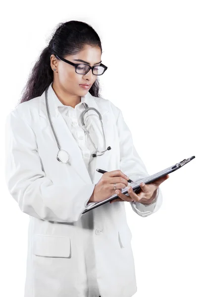 Indian female doctor with clipboard — Stock Photo, Image