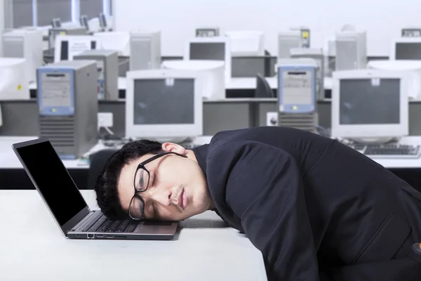 Entrepreneur in business suit sleeping in office — Stock Photo, Image