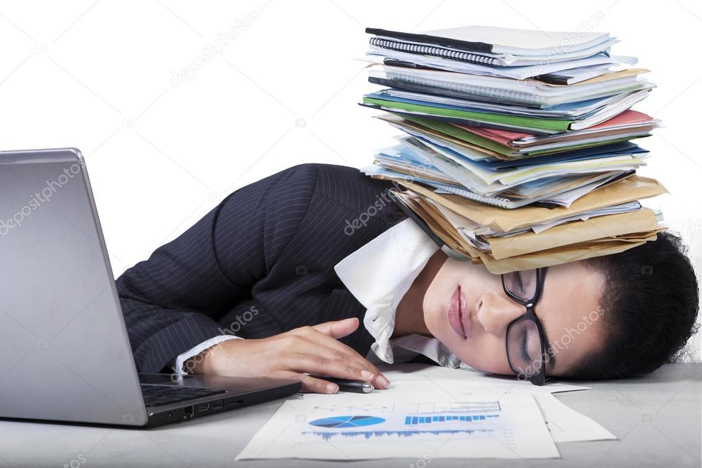 Overworked Indian Woman Sleeping On Desk Stock Photo