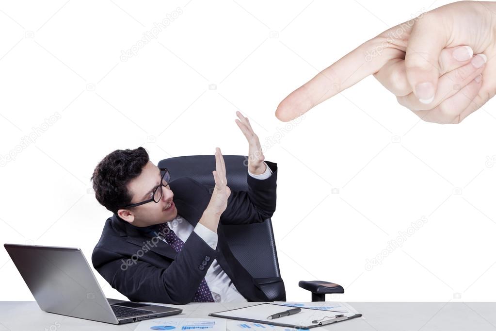 Hand pointing at caucasian businessman