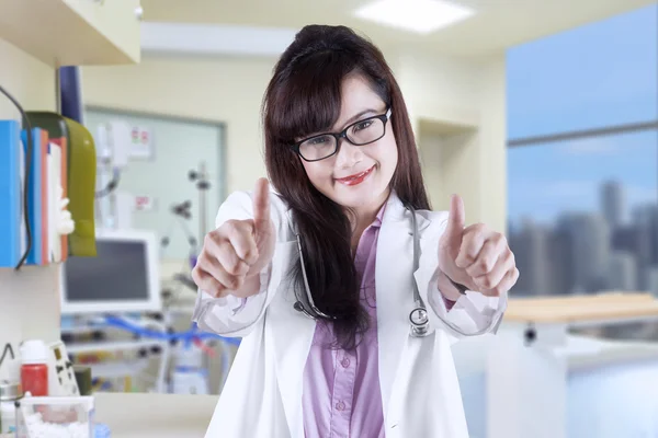 Attractive doctor showing thumbs-up 3 — Stock Photo, Image