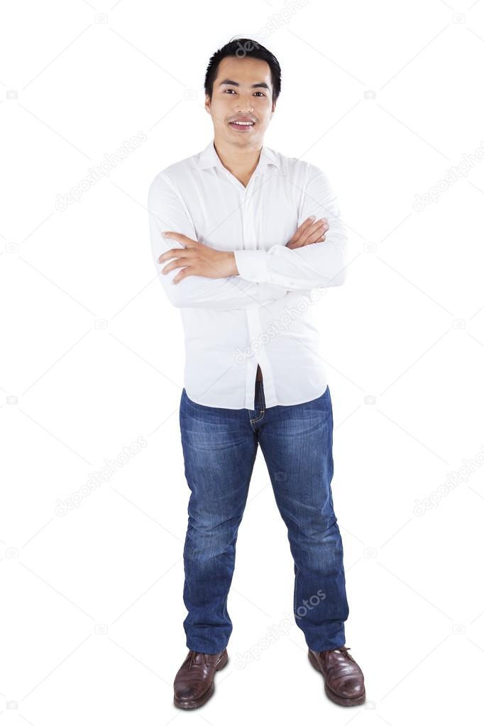 Happy casual man smiling in studio