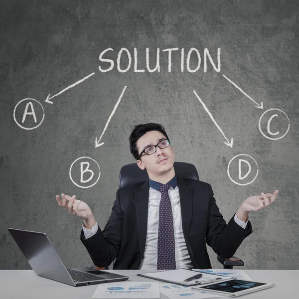 Confused man to choose a solution — Stock Photo, Image