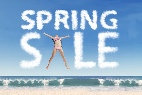 Sexy model forming spring sale text — Stock Photo, Image