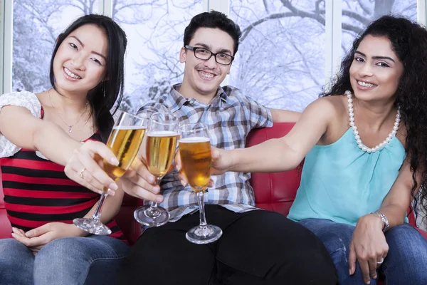 Multiracial friends toast with beer — Stock Photo, Image