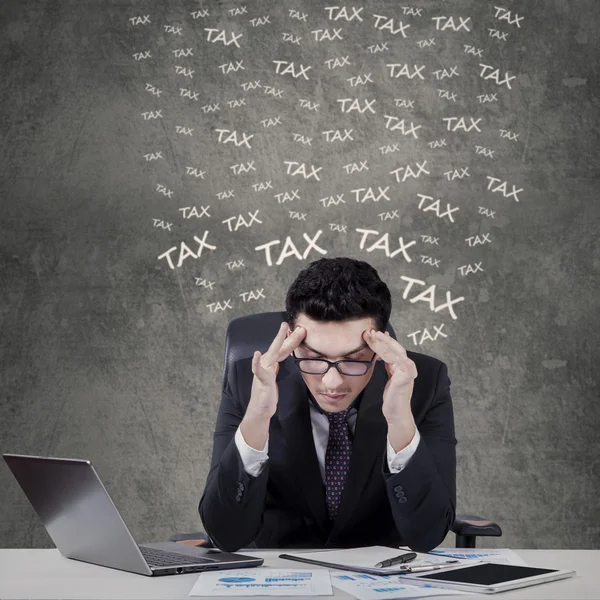 Stressful manager counting his tax — Stock Photo, Image