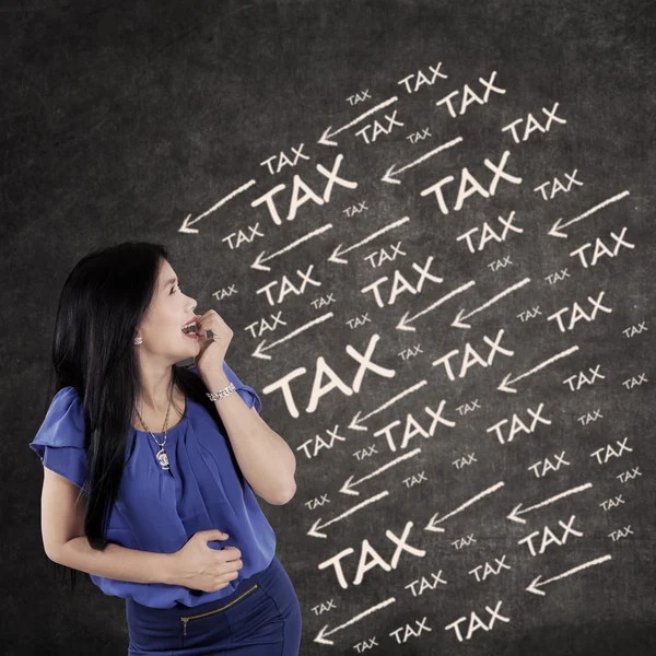 Worried female entrepreneur with tax pressure — Stock Photo, Image