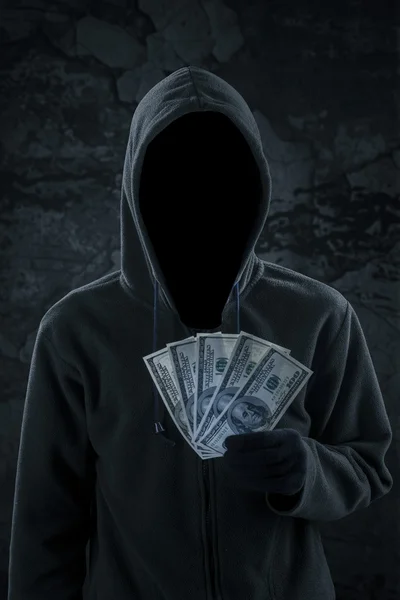 Mysterious burglar holding money cash — Stock Photo, Image