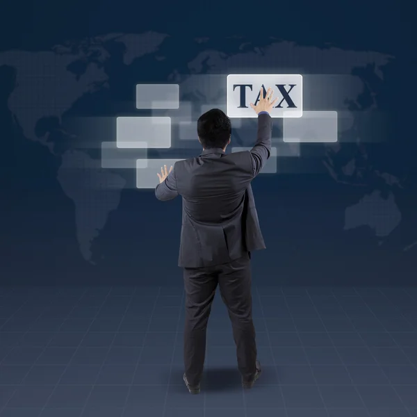 Manager with tax word on futuristic screen — Stock Photo, Image