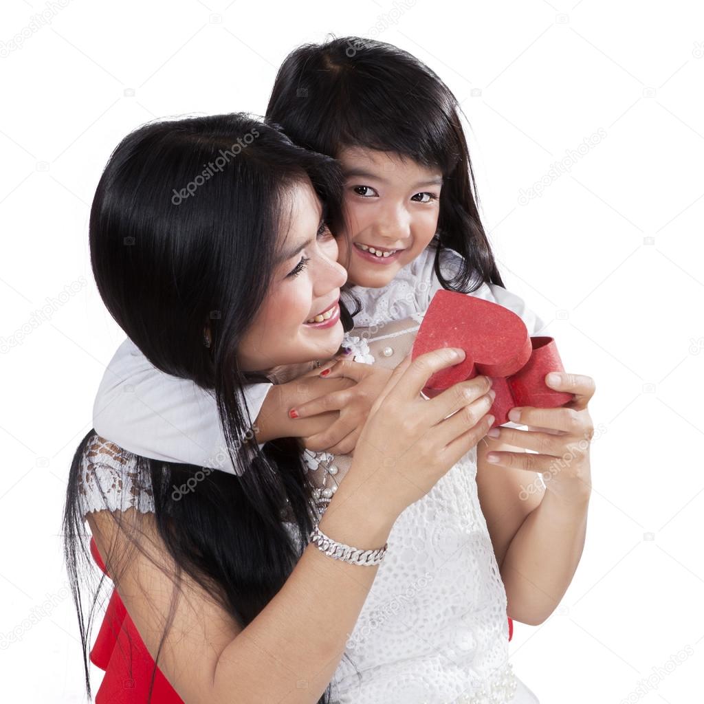 Happy mother get a gift from her daughter