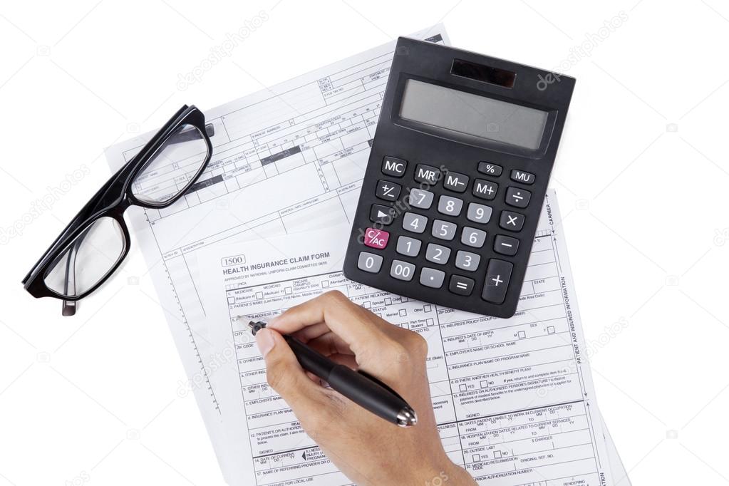 Person filling medical insurance form