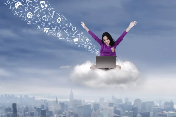 Student sitting on the cloud with laptop — Stock Photo, Image