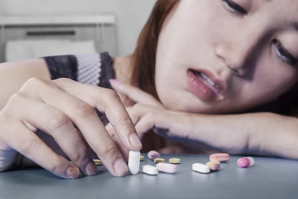 Young drug addict with capsule — Stock Photo, Image