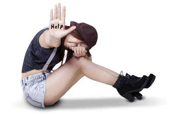 Depressed teenage girl showing help text — Stock Photo, Image