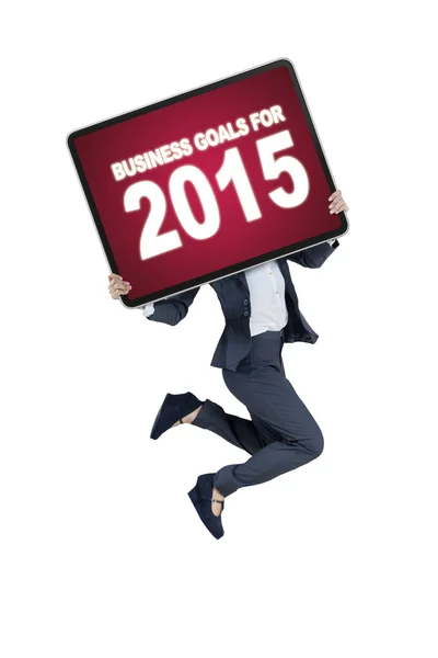 Trabalhador com um conselho de metas de negócios para 2015 — Fotografia de Stock