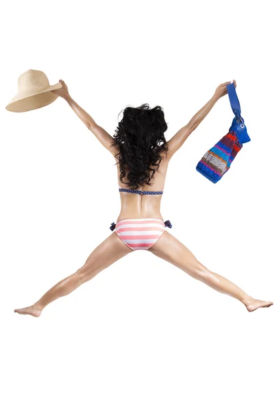 Woman wearing bikini jumping in studio 1 — Stock Photo, Image