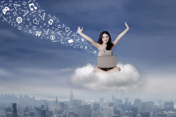 Girl sending message with laptop on cloud — Stock Photo, Image