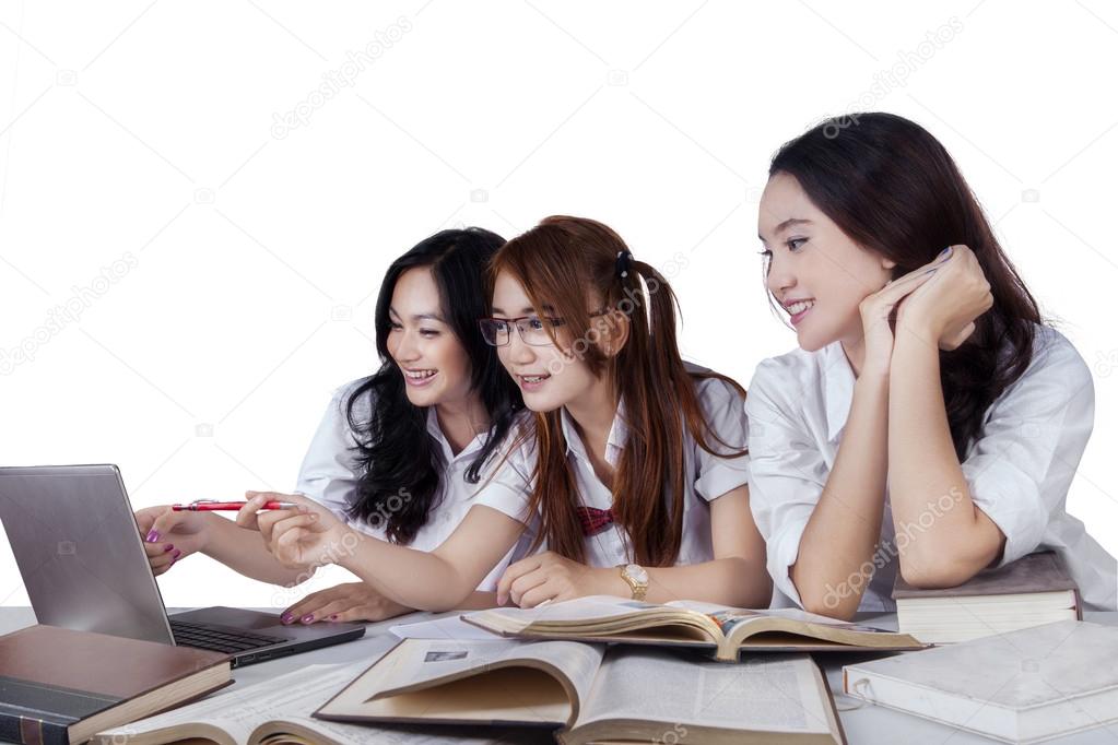 Three student studying on desk
