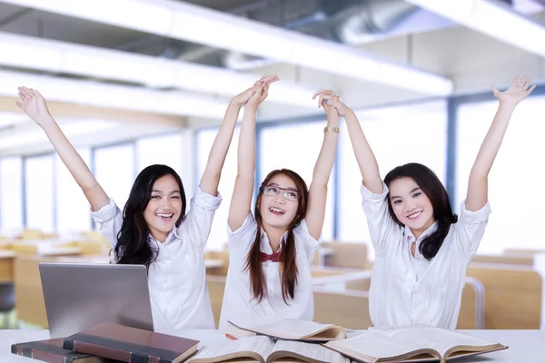 Group of attractive students raise hands — Stock Photo, Image