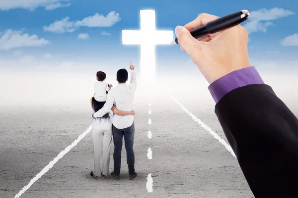 Family guided to follow a cross — Stock Photo, Image