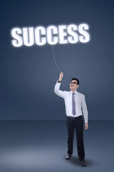 Male worker pulling a success text — Stock Photo, Image