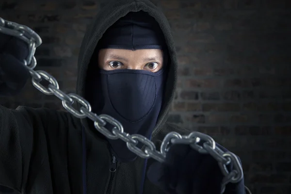 Murderer holding chain — Stock Photo, Image