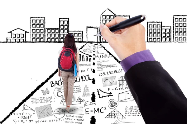 Schoolgirl walking on doodles toward a door — Stock Photo, Image