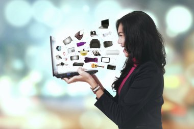 Cheerful woman with ecommerce products