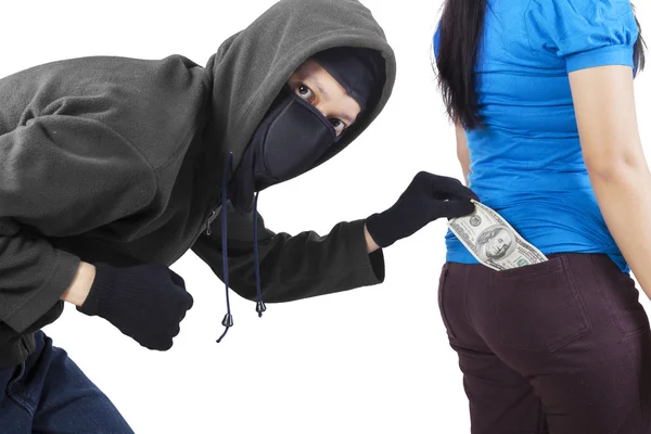 Pickpocket in action to take money — Stock Photo, Image