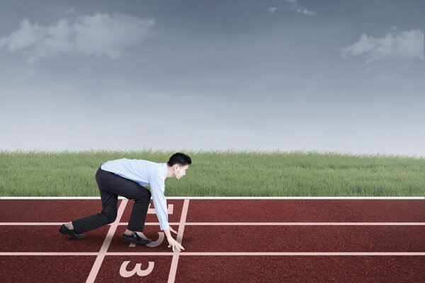 Businessperson ready to race and compete