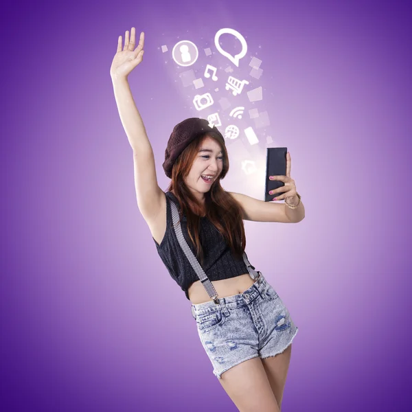 Cheerful girl enjoy entertainment on smartphone — Stock Photo, Image