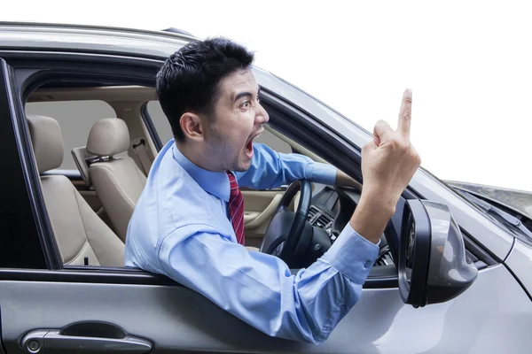 Rude person showing middle finger in the car — Stock Photo, Image