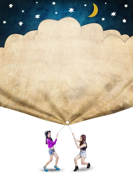 Two student pull a banner of their dreams — Stock Photo, Image