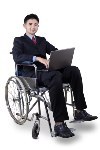 Disabled worker with laptop on wheelchair — Stock Photo, Image