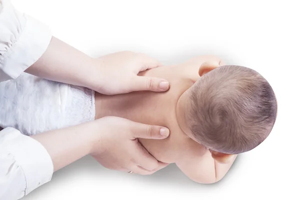 Handen massage de rug van baby — Stockfoto