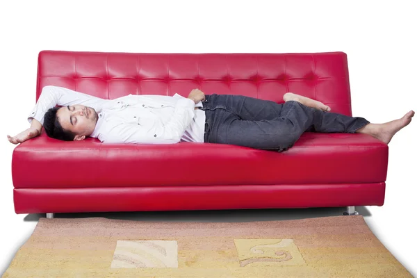 Young man take a rest on sofa — Stockfoto