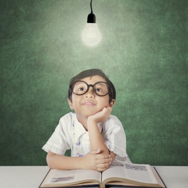 Cute girl look up at lamp