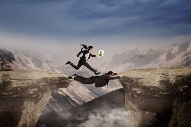 Woman pass a gap with her partner