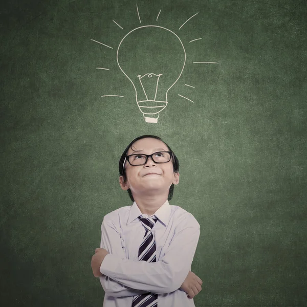 Close-up business kid on lamp drawing — Stock Photo, Image