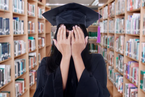 Student with graduation gown peeking — Stock Fotó