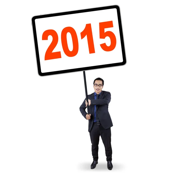 Worker holds a board with number 2015 — Stockfoto